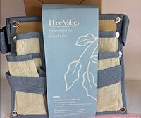 Front view of Lee Valley adjustable garden pouch in original package