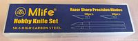 Front of sealed case showing Mlife branding, SK-5 steel note, blade and handle illustrations