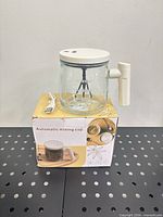 cup on box with USB cable visible