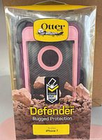Front view of sealed OtterBox Defender Series pink and purple case for iPhone 7 in retail box