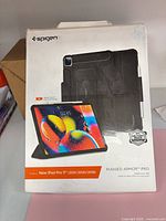 Front of sealed retail box showing product image and compatibility