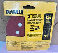Front view of one sealed DeWalt DW4303 5-pack showing branding, size, grit and disc cut-outs