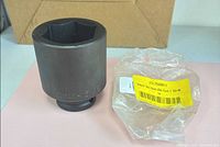 Full view of socket beside original plastic bag showing label