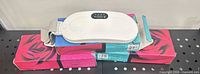 One heating pad on top of two boxed units showing overall design