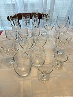 Full group of assorted stemware on table