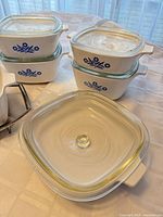 Grouped view of casseroles with lids showing Cornflower pattern and lid design