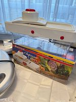 Starfrit Supreme Slicer mandoline with box and container