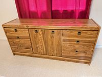 Front view of the dresser showing six drawers and two centre doors