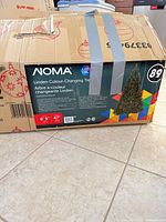 Manufacturer’s box showing NOMA Linden colour-changing tree, 6.5 ft, LED details