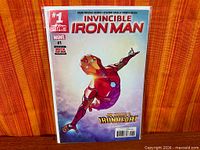 Front view of Invincible Iron Man #1 comic in bag and board