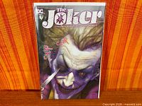 Front view of bagged Joker #1 variant comic