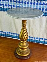 Full view of pedestal stand showing marble top and gilt base