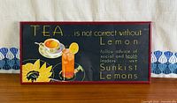 Full view of framed Sunkist Lemons advertising poster
