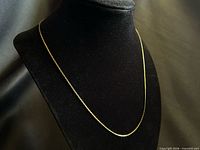 Full view of the necklace displayed on black bust