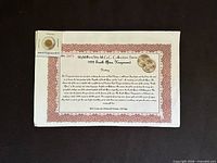 Coin in flip attached to certificate sheet showing full presentation