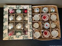 two boxes showing all 24 ornaments