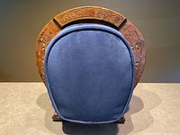 Front view showing horseshoe frame, GOOD LUCK banner and cushion