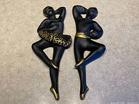 Front view both ballerina plaques showing design and color