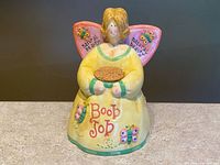 Front view showing full design, text, colours, and cork in place