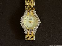 Front view showing dial, bezel, diamonds and bracelet