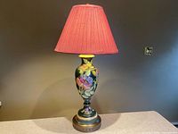 Full view of ceramic table lamp with pleated shade