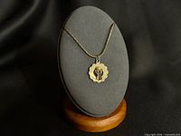 Full necklace displayed on stand