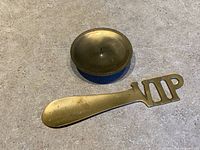 Shoe horn and candle holder together