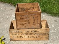 Both wooden crates stacked showing main stencilled texts