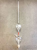 Full view of glass hydrometer showing entire length and structure