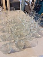 Group of 8 tumblers and 6 wine goblets on tabletop