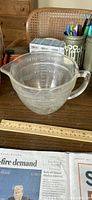 Clear glass 1-qt mixer bowl showing handle, spout and measurements