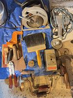 Group shot of all tools on blue tarp