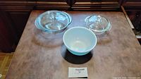 Overall view of three Pyrex glass pieces on tabletop