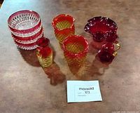 All nine glass pieces grouped on tabletop