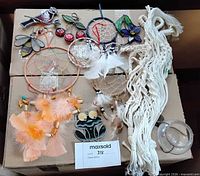 Group shot showing dreamcatchers, macramé hanger, stained glass ornaments and glass terrarium globe