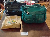 Front view of three bags showing colours, styles and exterior pockets