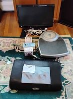 Front view of monitor, scale, massager, PeriPage and telescope boxes, cables