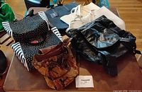 All six assorted unbranded bags arranged on table