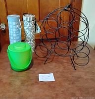 All four items grouped: wine rack, ice bucket, two bottle carriers