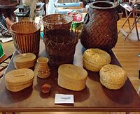 All nine wicker and straw pieces arranged on table