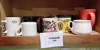 Shelf view showing full assortment of mugs
