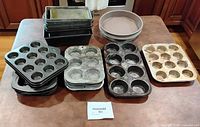 Group shot showing muffin pans, loaf pans stack and round cake pans