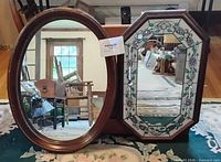 Oval and octagonal wood framed mirrors with stained glass detailing
