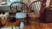 Rear view of two Windsor spindle-back chairs