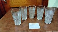 Front view of all five pressed diamond highball glasses