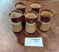 All five tumblers grouped on tabletop