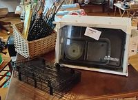 Showtime Pro rotisserie oven, wire basket, skewers and forks in wicker holder