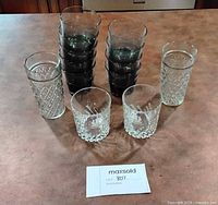 All 13 glasses grouped: smoky tumblers, cut highballs, Glenlivet tumblers