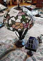 Full view of large floral lamp and small blue accent lamp