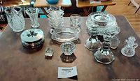 Entire assortment of pressed and cut glass items arranged on table